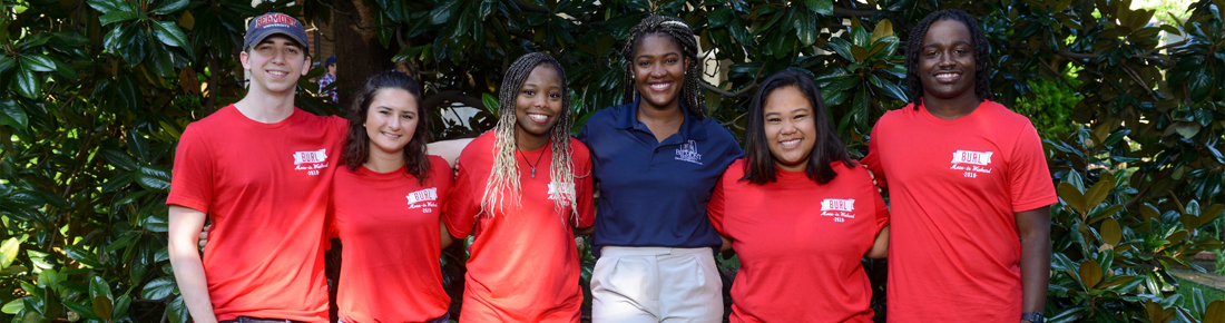 Belmont Resident Life staff pose for a photo wearing matching t-shirts.