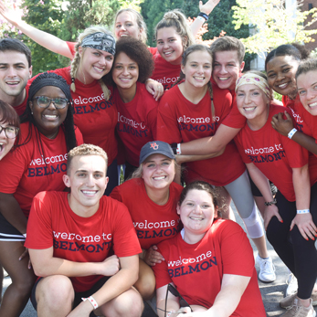 A large group of Belmont students pose for a photo together on move-in day.