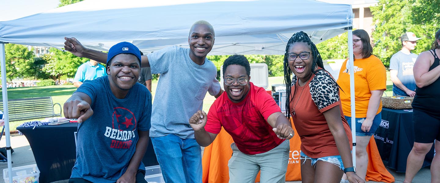 Students smiling for picture at Bruinlink fair