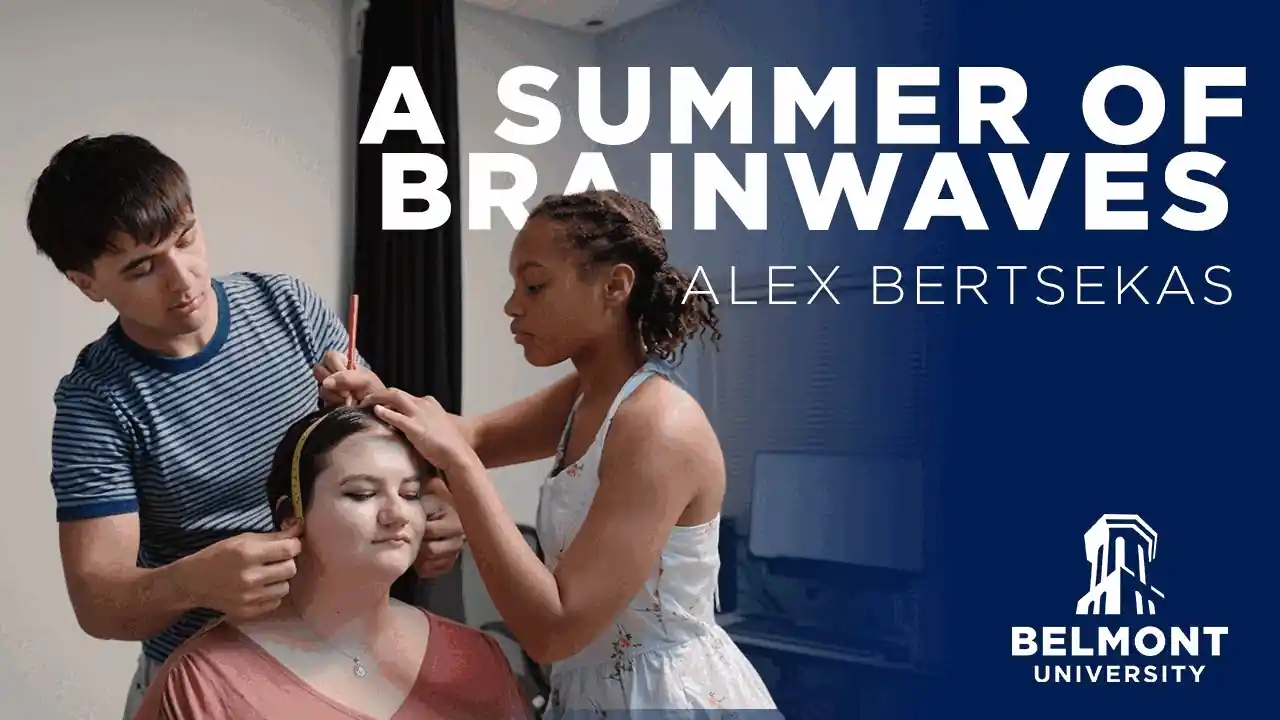Three Belmont University students conduct a brainwave research activity. A student wears a headpiece sensor while two peers assist—one in a striped blue shirt and another in a light tank top adjusting the equipment. The overlay reads "A Summer of Brainwaves" by Alex Bertsekas, with the Belmont University logo in the lower right.