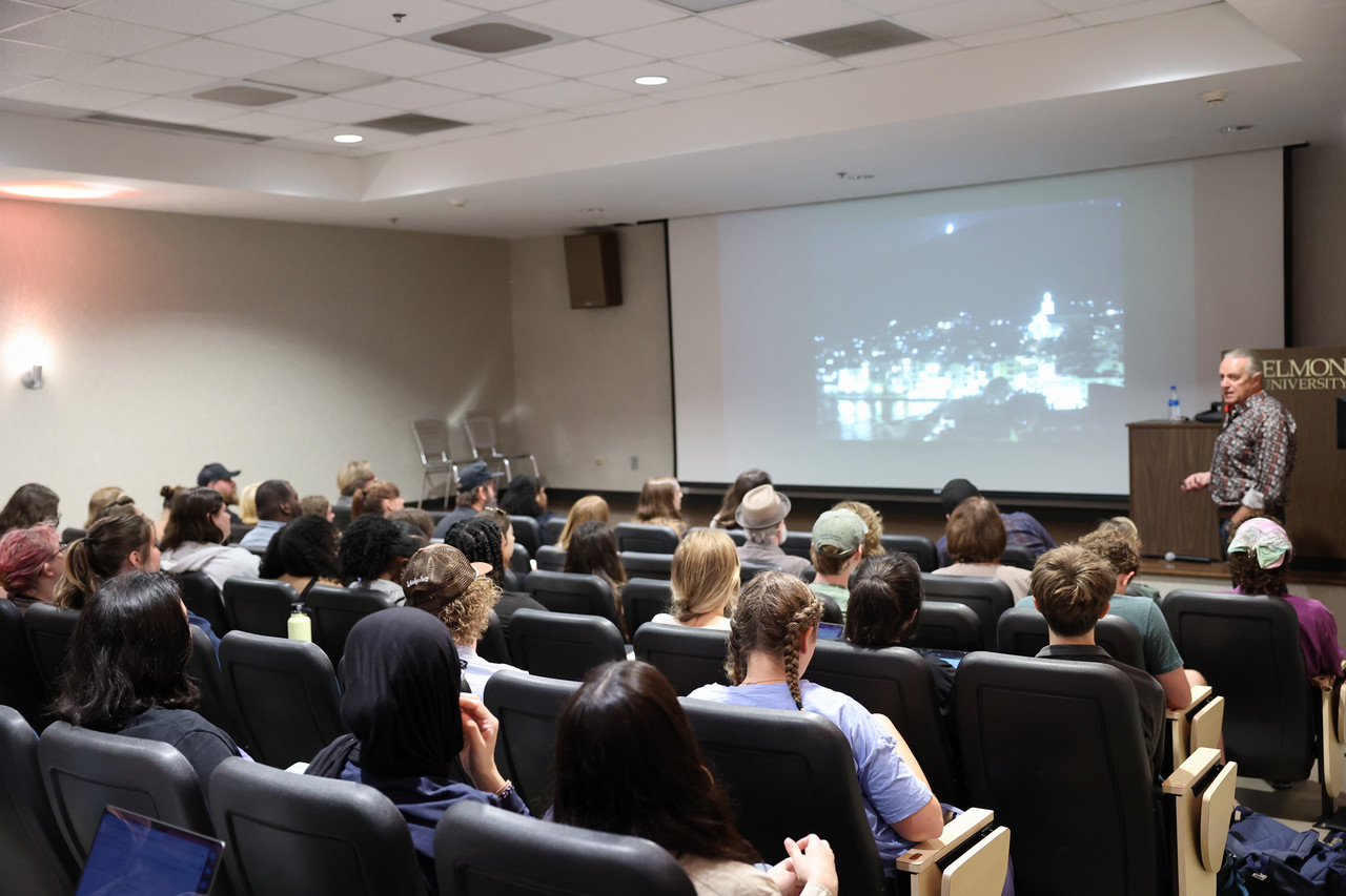 Tom Carr presenting about his past work at the Creative Professional Lecture Series