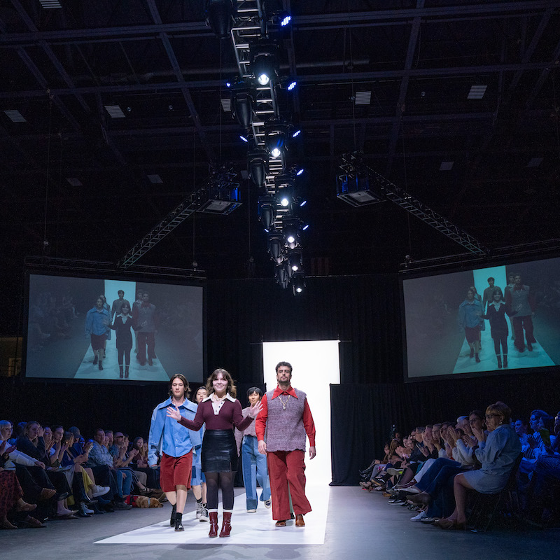 Junior student Jey Maroney's menswear collection, models wearing red, blue and green clothes 