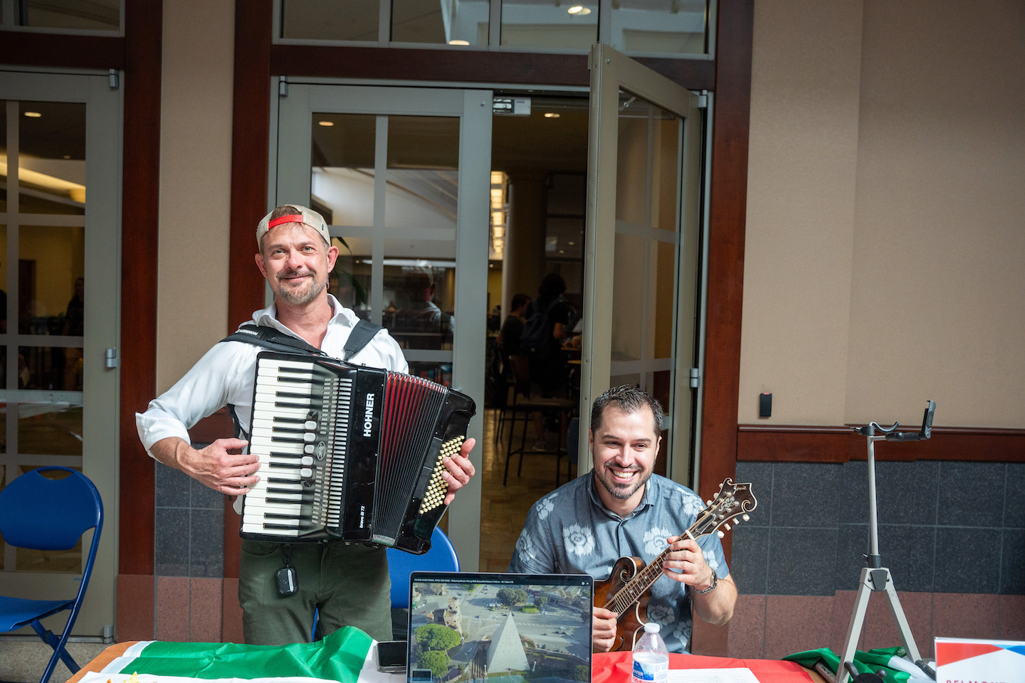 participants at the global fair holding instruments representative of the country their program is held in