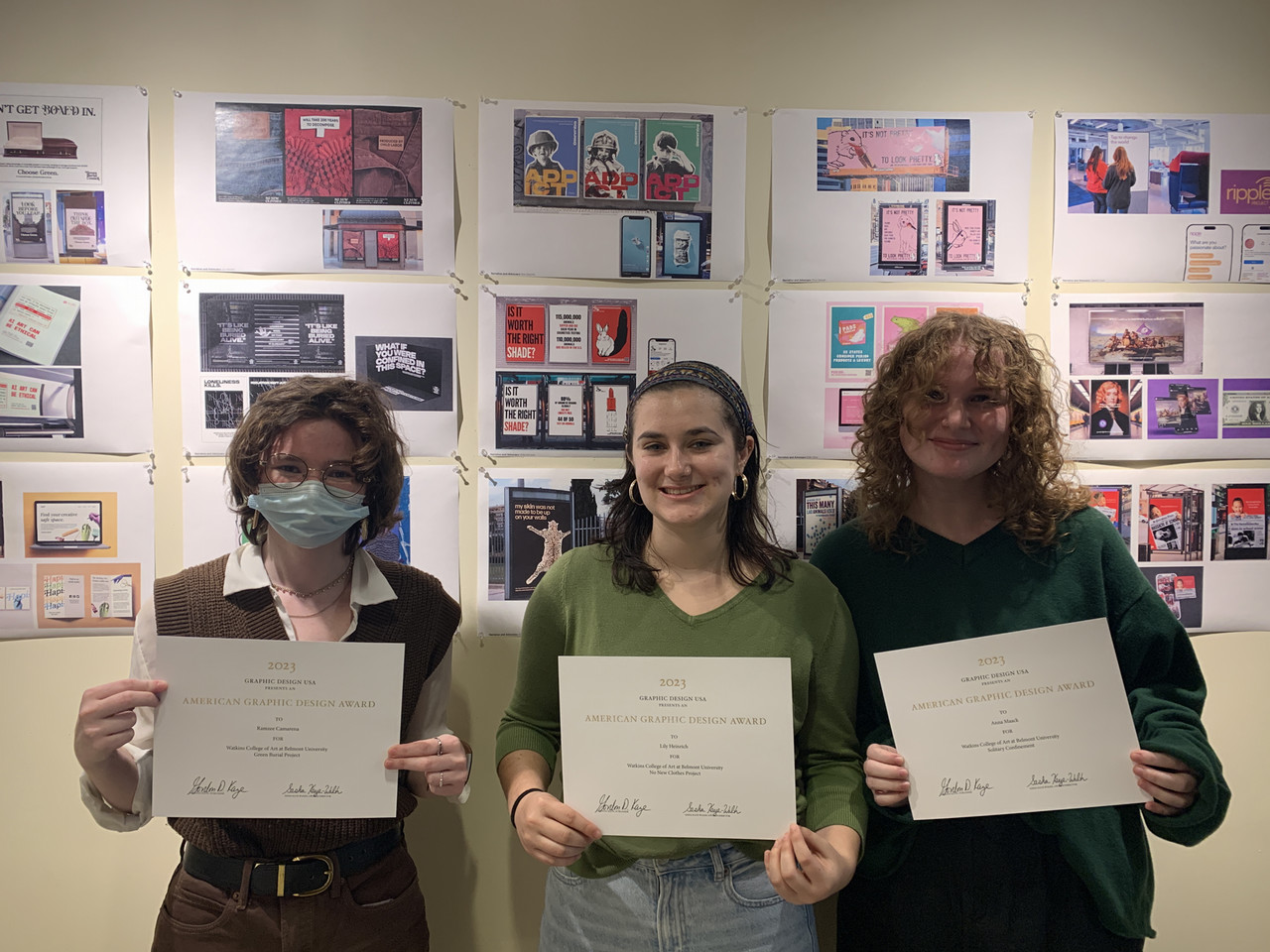 Students Ramzee Camarena, Lilli Heinrich and Anna Maack stand side by side with their GDUSA awards