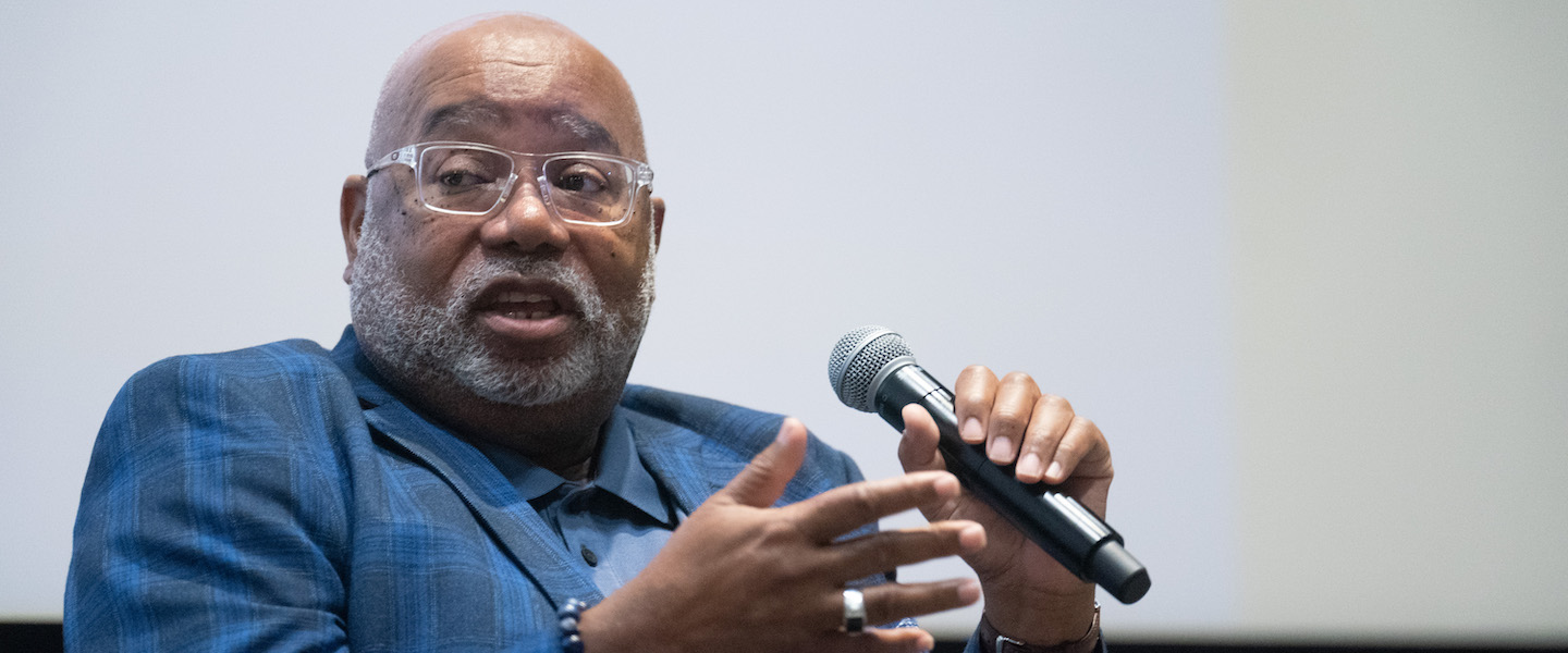 Bernard Turner speaking into a microphone