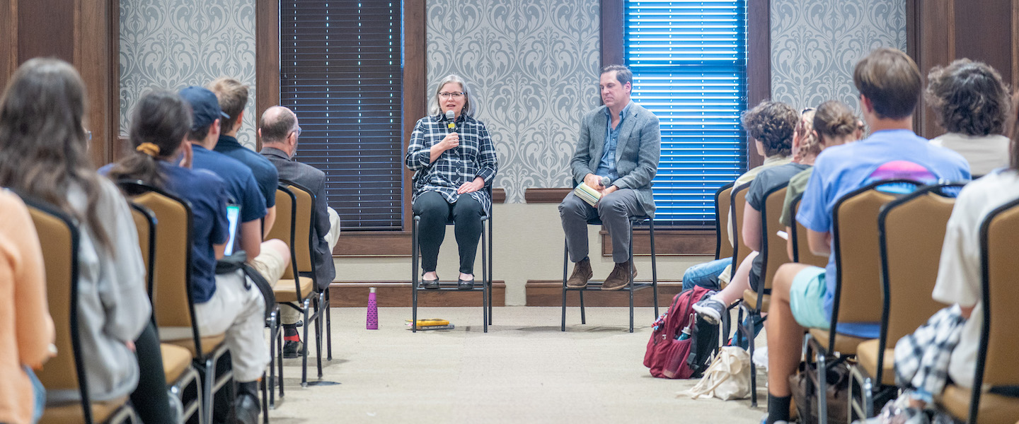 Margaret Renkl and Dr. Pete Kurlya speak in front of students