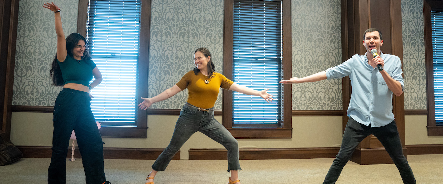 Belmont student and two humanities symposium speakers participate in improv