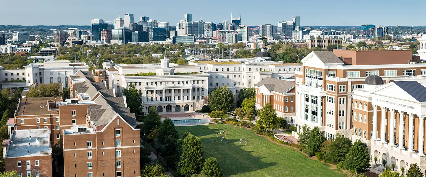 Aerial view of Belmont University’s campus with the Nashville skyline in the background.