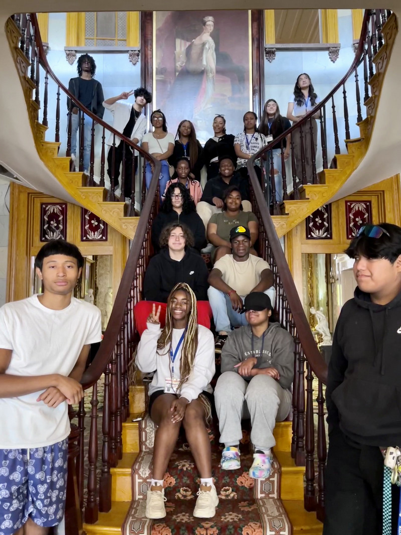 MNPS students pose in the Belmont Mansion on the staircase