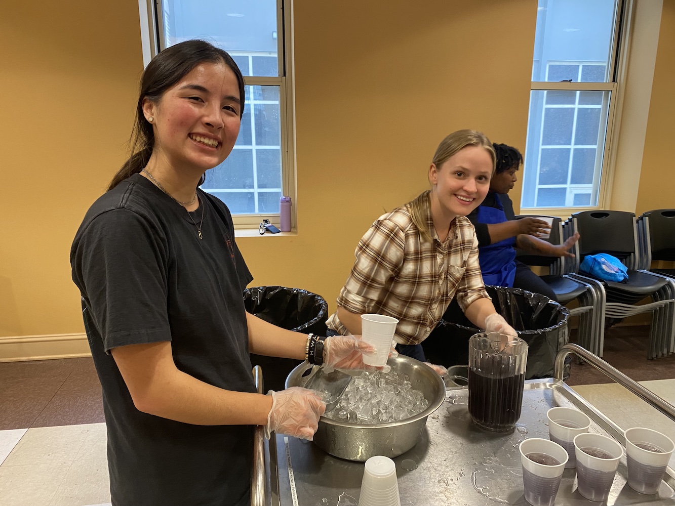 Two students prepping drinks for dinner service at Jacob's Well in Memphis