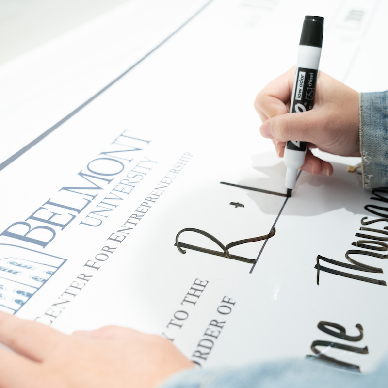 Giant check being written out