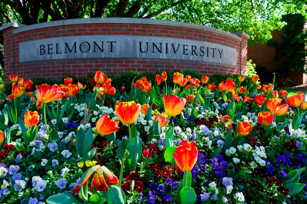 Sign that reads "Belmont University" with flowers in front