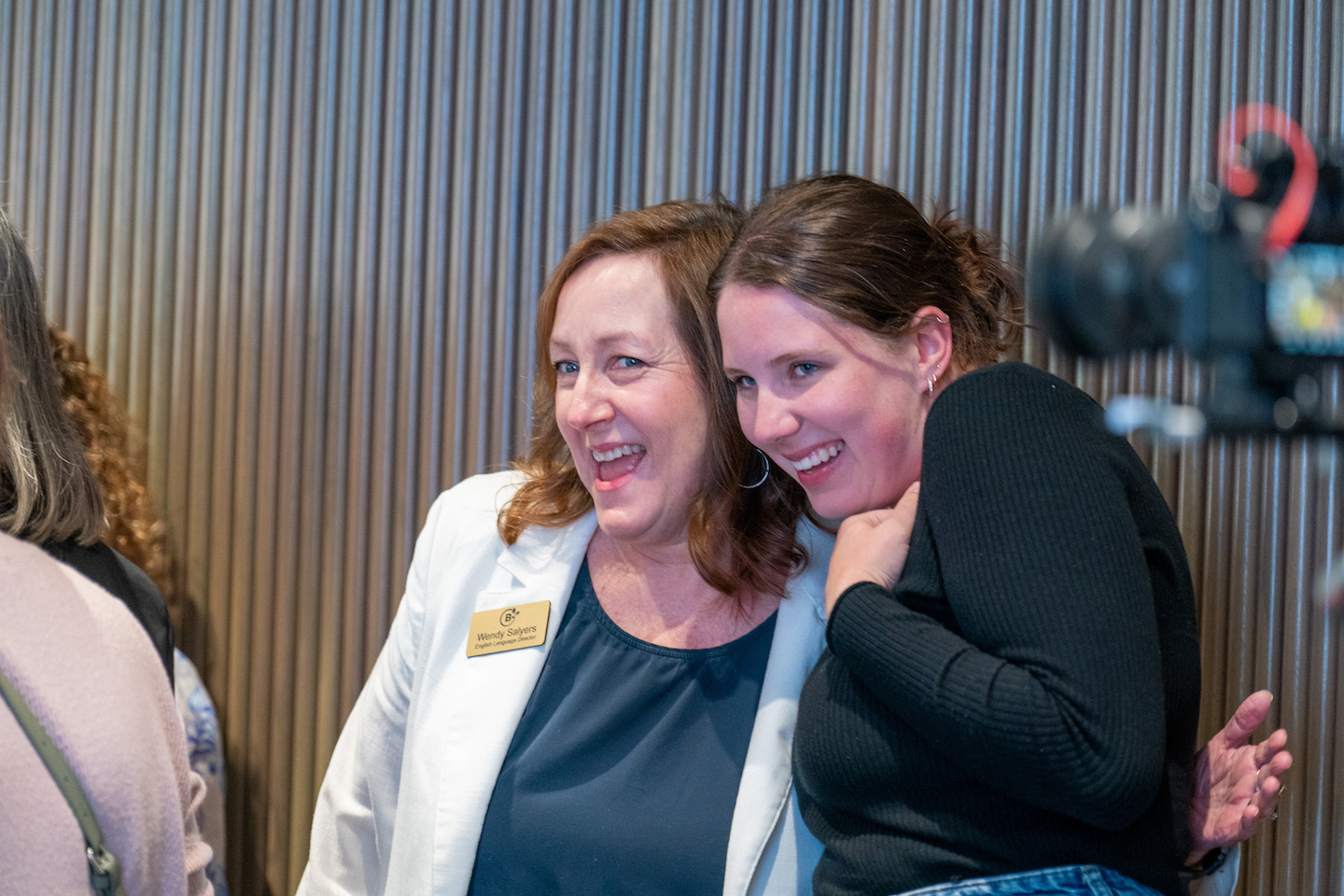 Participants greet each other at the beginning of the presentation