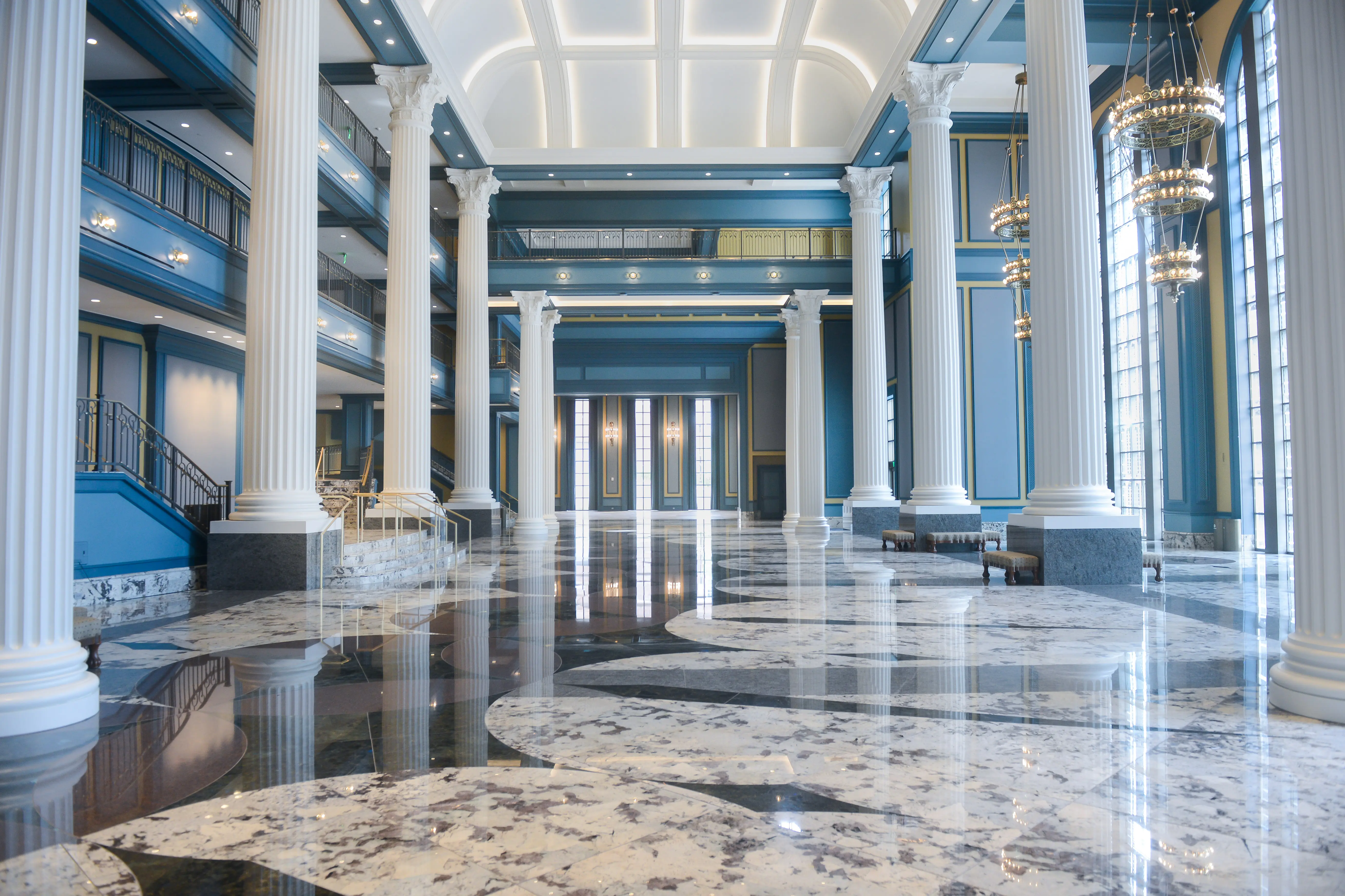 Fisher Center, Blue Walls and tiled floor with gold and bright chandeliers, tall ceilings