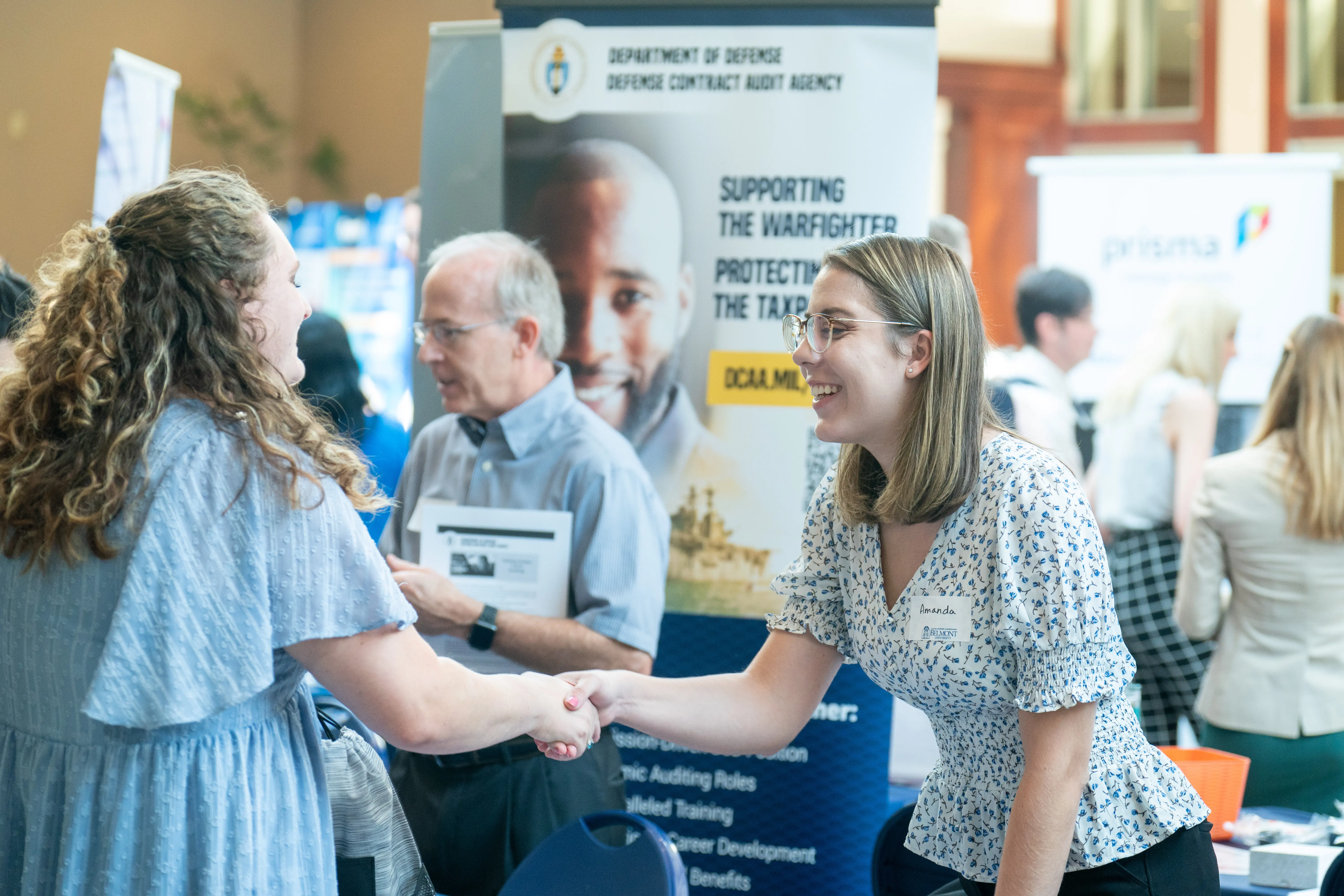 Blue logo of Jack C. Massey's 50 years on tile in Barbara Massey