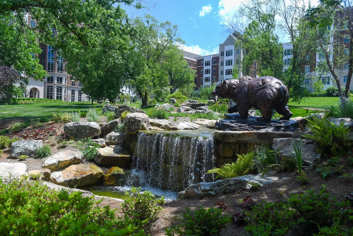 Bear Creek Lawn's bear statue and waterfall pond