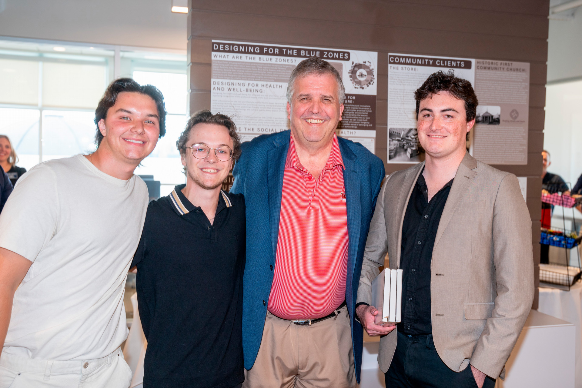 Design team pictured with University President Dr. Greg Jones