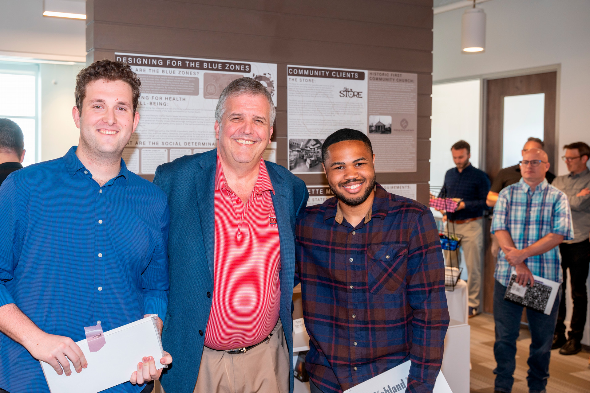 Design team pictured with University President Dr. Greg Jones