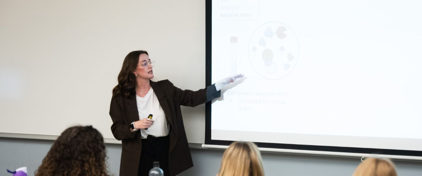 A student presents their research to a classroom of other students