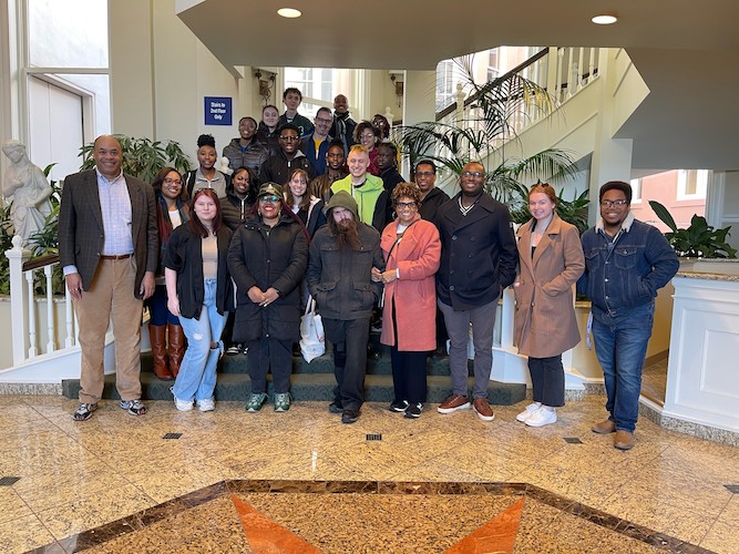 Group photo of people attending the Social Justice Bus Tour