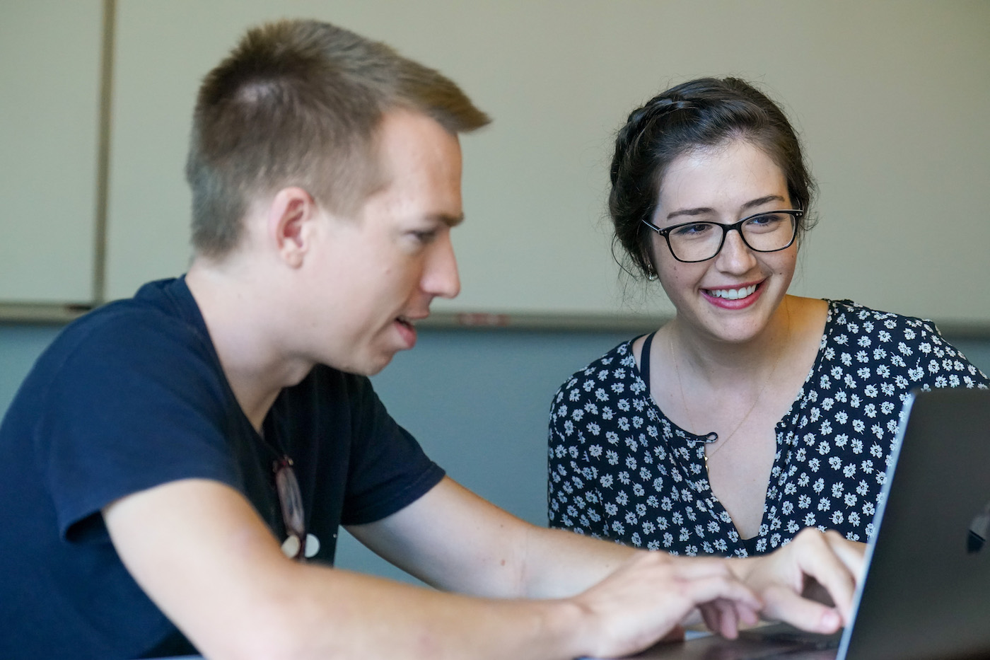 Davis helps student on computer