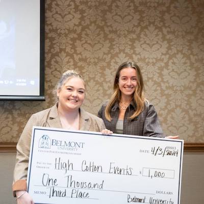 Emma Collums holds third place check with Jami-lyn Fehr