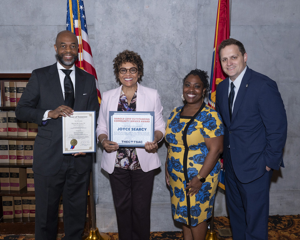 Joyce Searcy with her award, Love Jr, Brittany Mosby and Steve Gentile