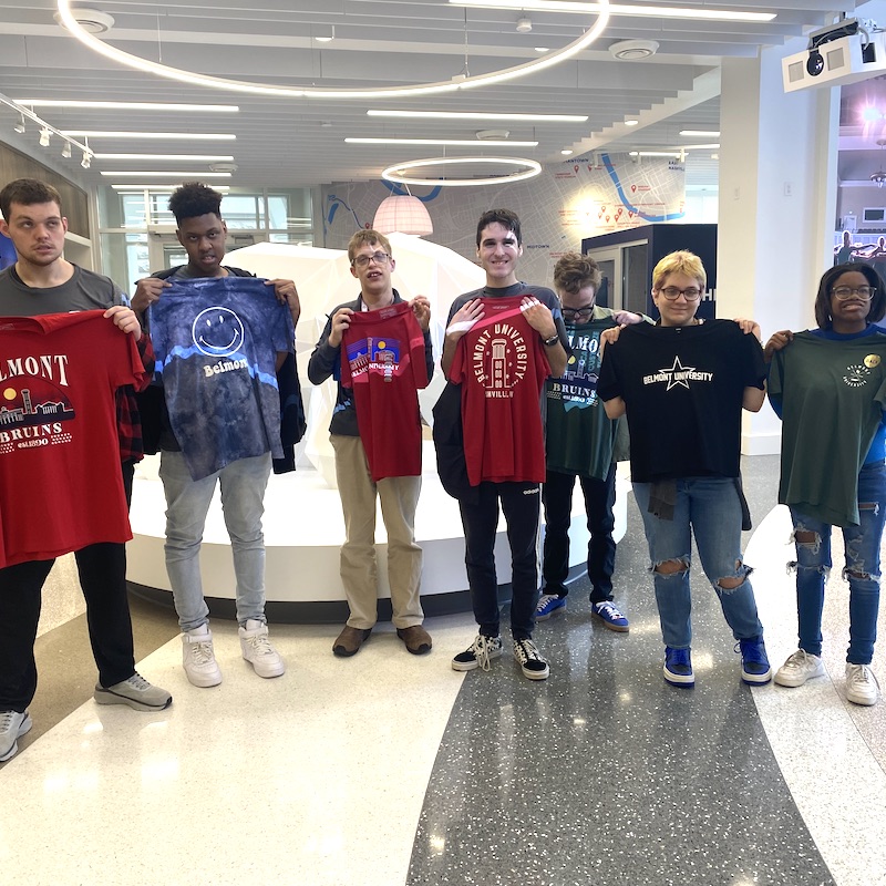 MNPS students holding Belmont shirts in the Bruin Shop