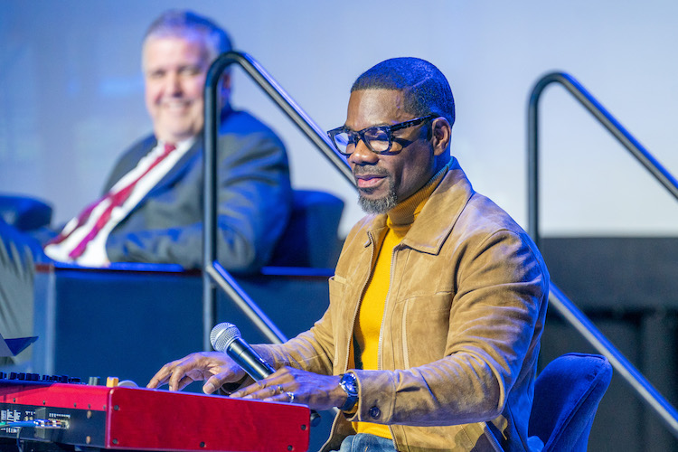 Kirk Franklin playing the piano