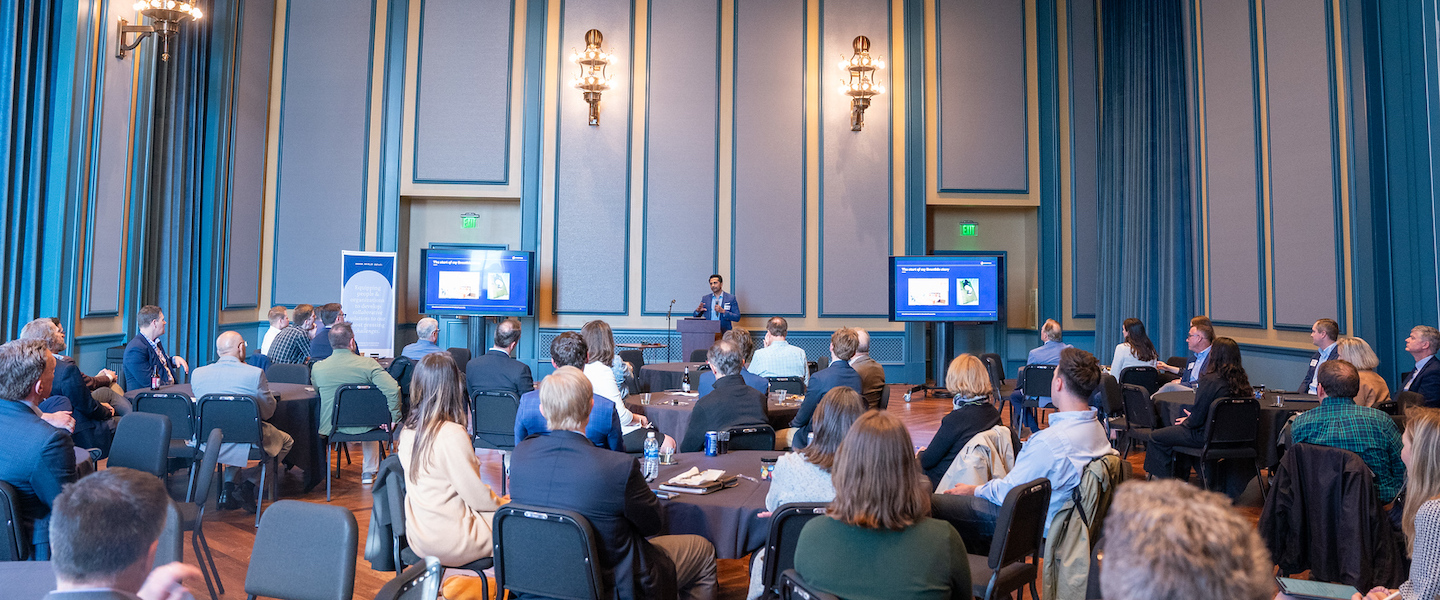 John speaking at event