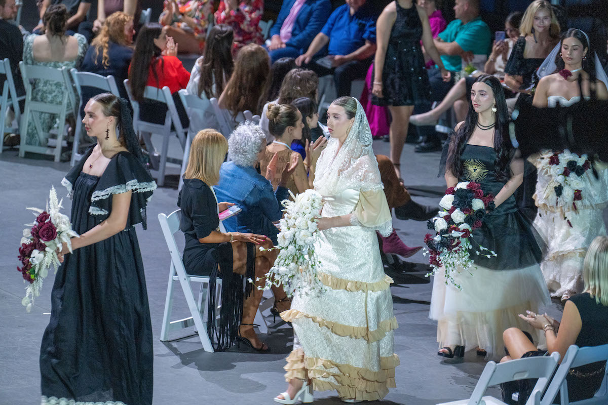 A bridal-themed collection featuring vintage lace, tulle, and floral bouquets brings a nostalgic, romantic flair with black, white, and cream gowns.
