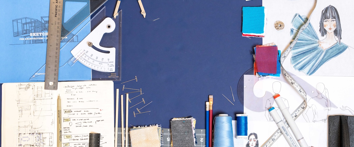 flat lay of architecture and design materials on a blue background