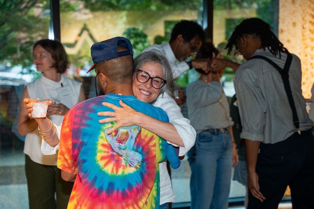 person hugging at artist