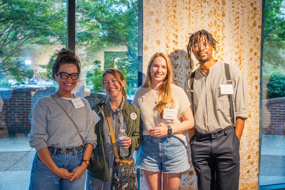 Smiling faces at the closing reception