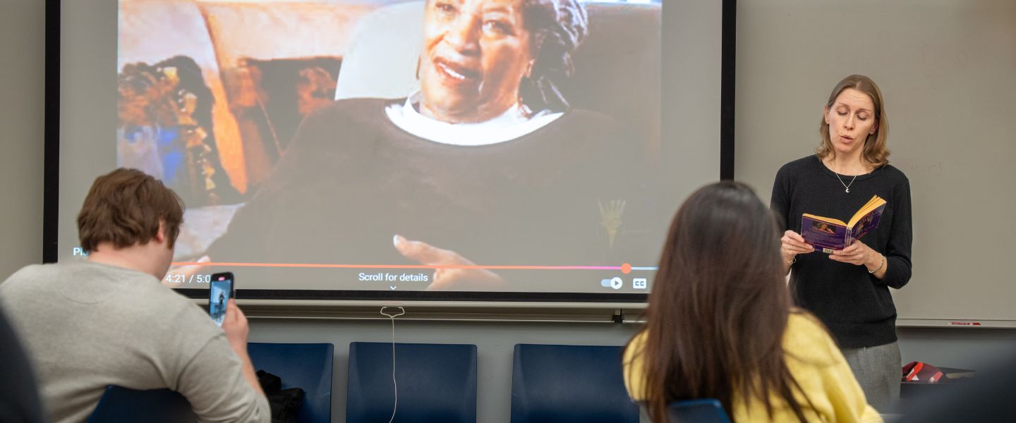 Dr. Caresse John in front of a class
