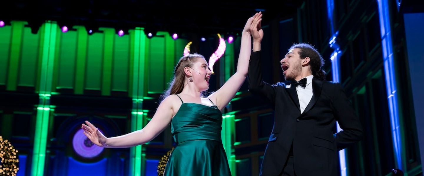 Two musical theatre students dance on stage