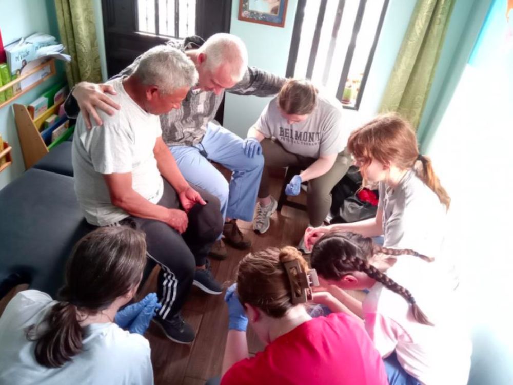 Mission team prays with locals in Guatemala