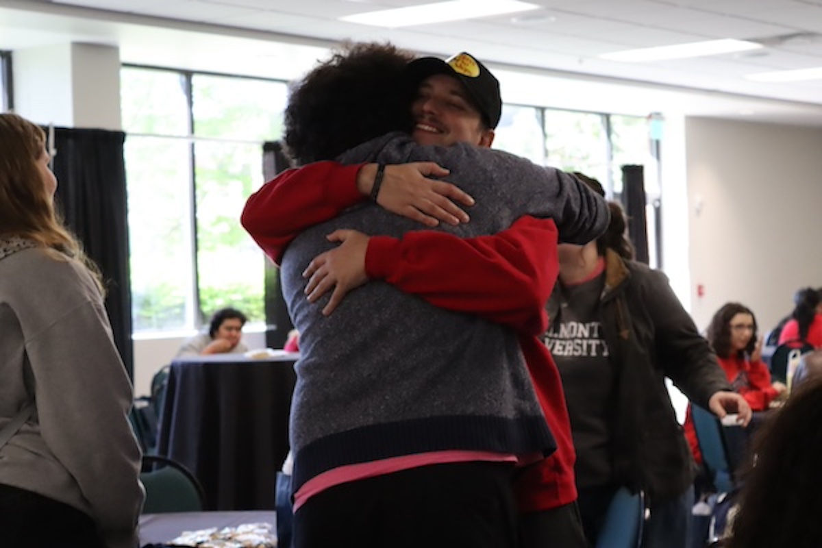 two individuals hugging