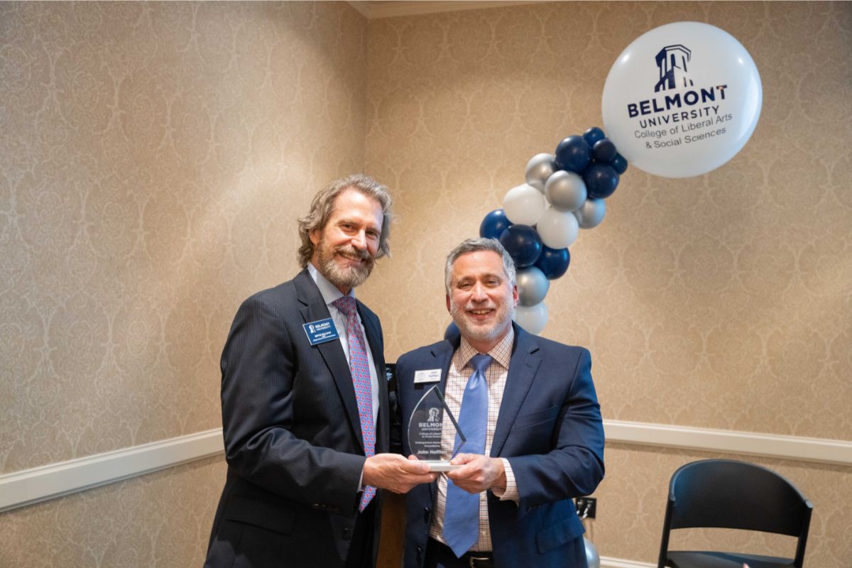 CLASS Dean Dr. Bryce Sullivan awards Jon Nefflen the inaugural CLASS Distinguished Alumni Award