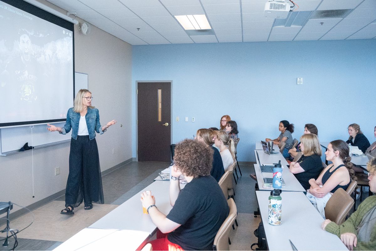 professor standing in front of her class