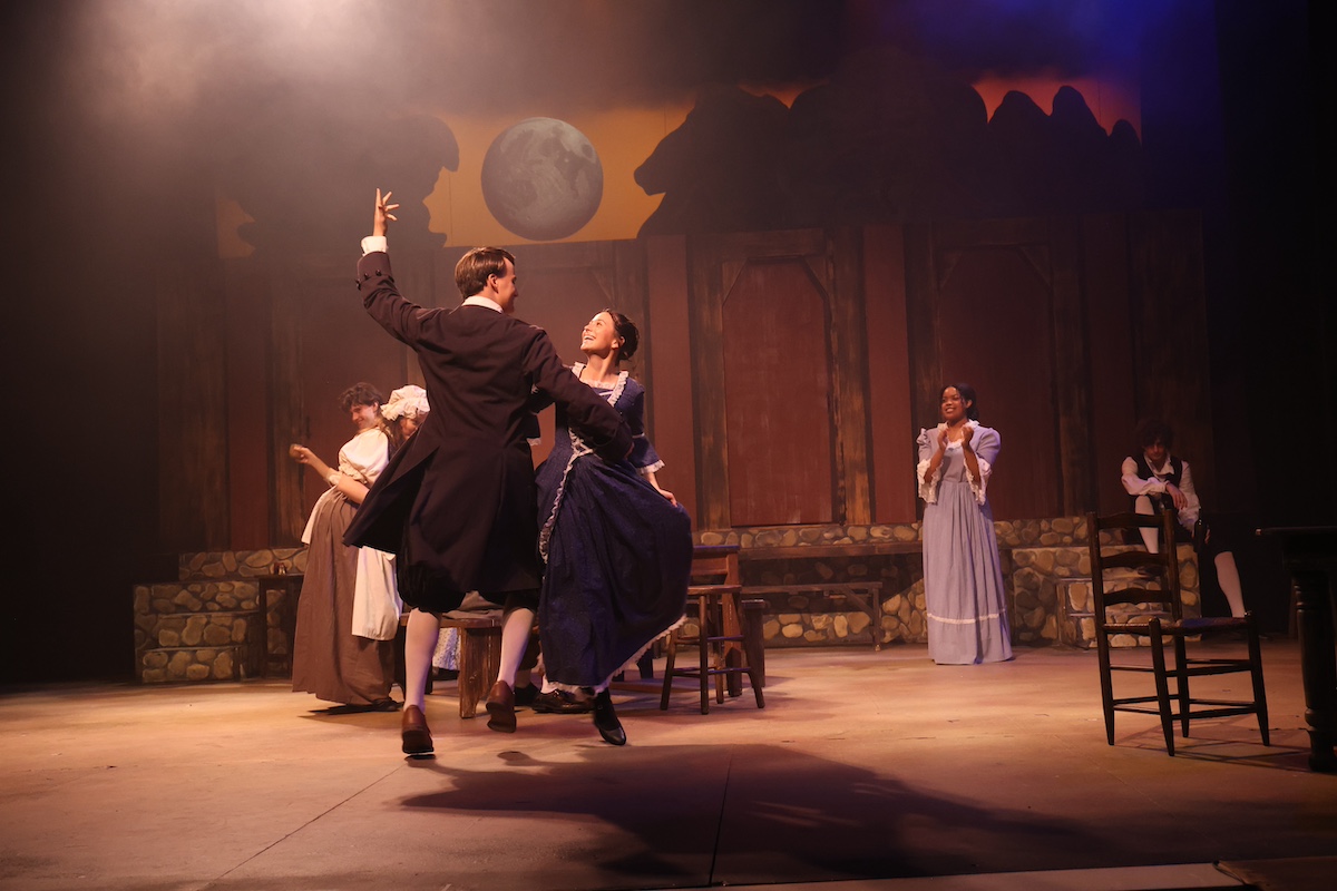 two actors dancing in old-timey clothes