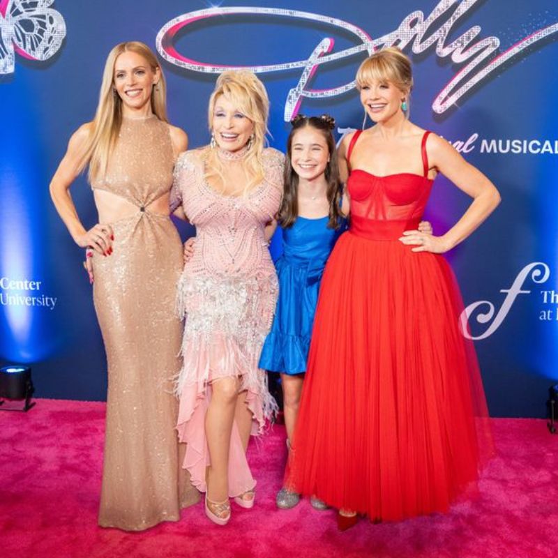 Dolly Parton with actors from 'Dolly: A True Original Musical'