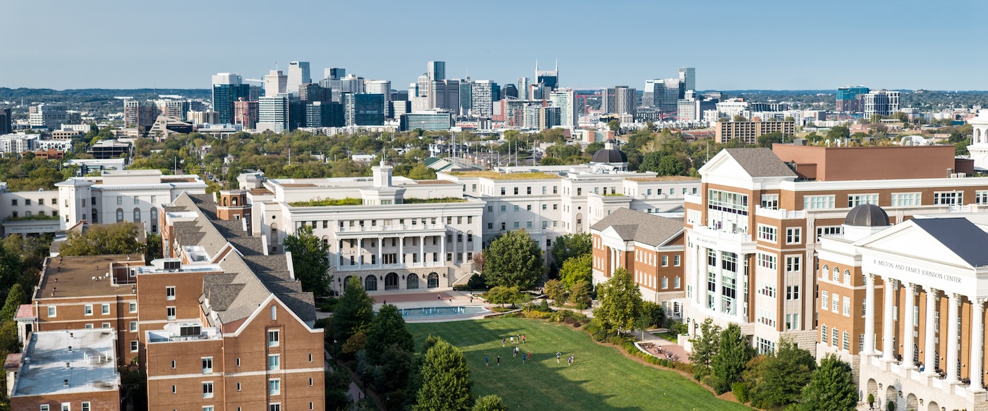 drone shot of belmont looking over Nashville skyline