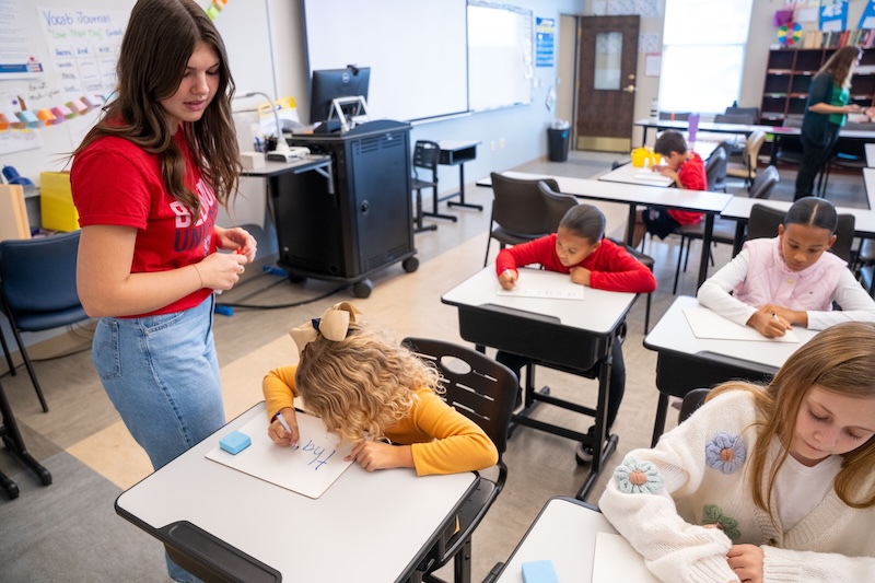 Elle Thrush teaching students in class