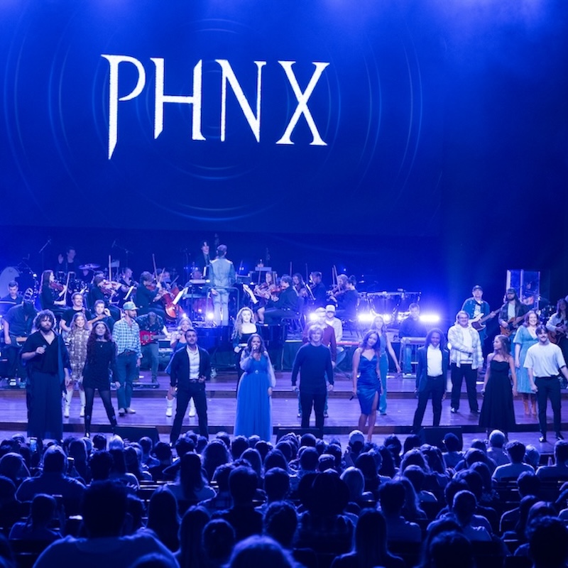 Singers perform on stage