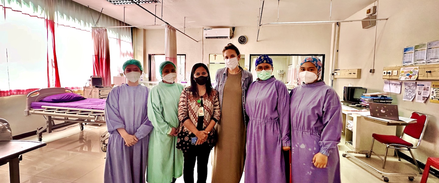 Dambrino with partners at health care clinic