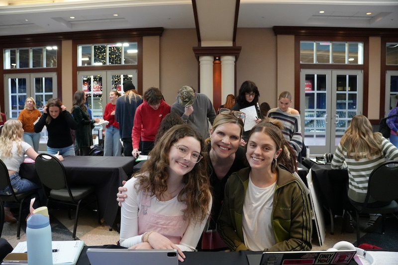Dr. Amy Hodges Hamilton poses with students at the Journey Showcase