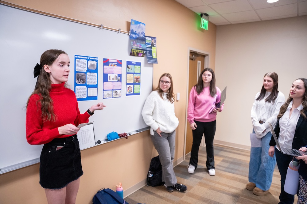 student presents her groups research