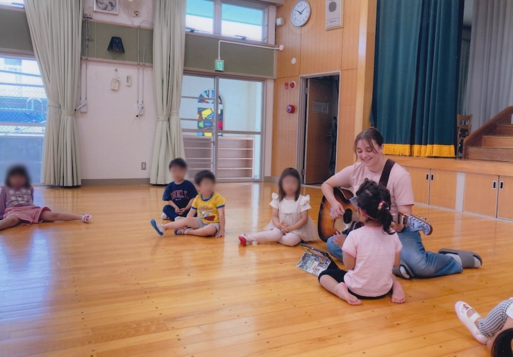 Lockney plays guitar for children