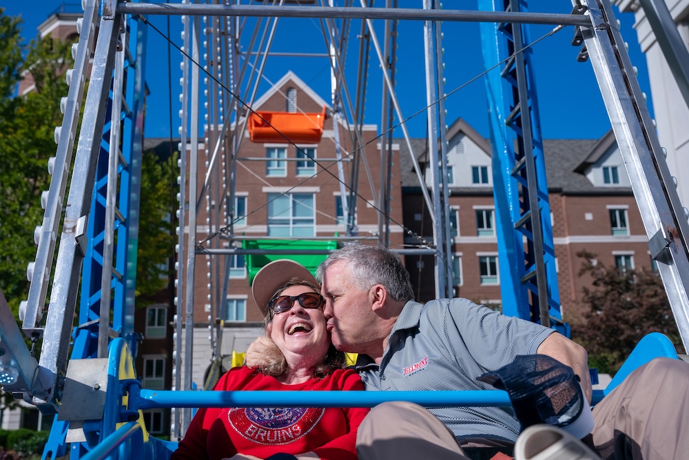 Greg and Susan Jones kiss on ferris wheel